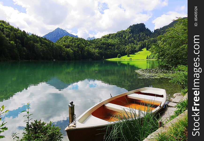 Boat Near Lake In The Mountains