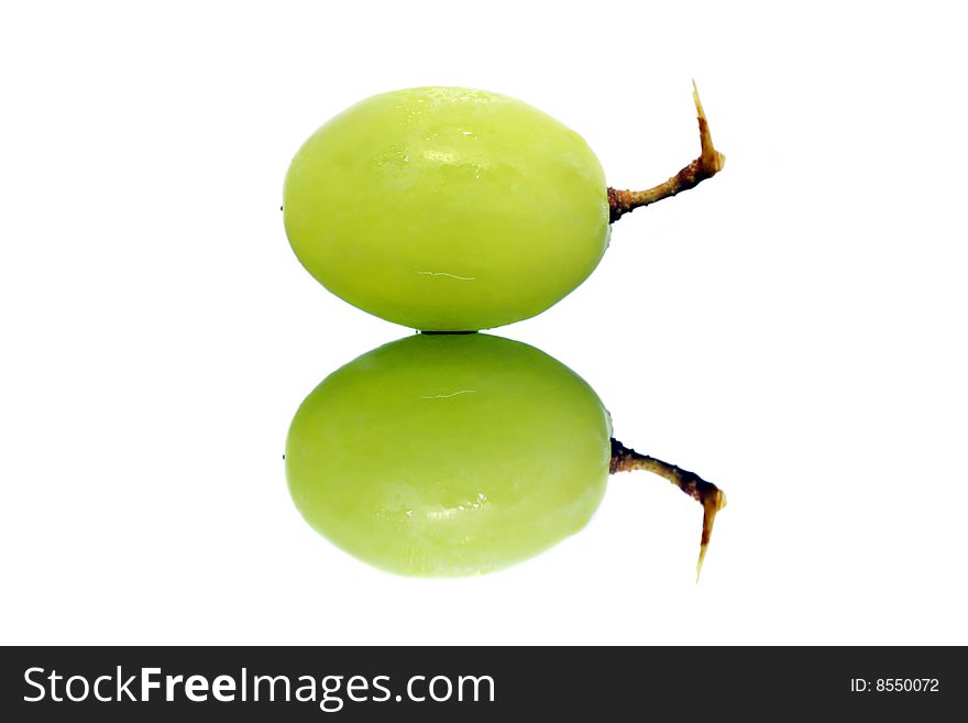 Close up of a green grapes isolated over white background.