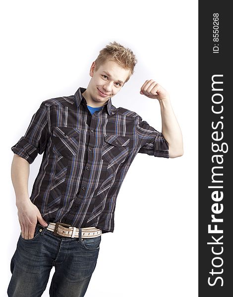 Isolated teen boy posing and pointing finger over white background. Isolated teen boy posing and pointing finger over white background