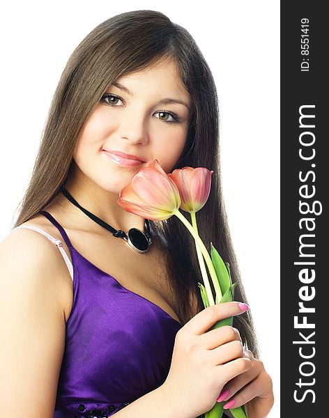 Portrait of a beautiful young woman holding two tulips in her hands. Portrait of a beautiful young woman holding two tulips in her hands