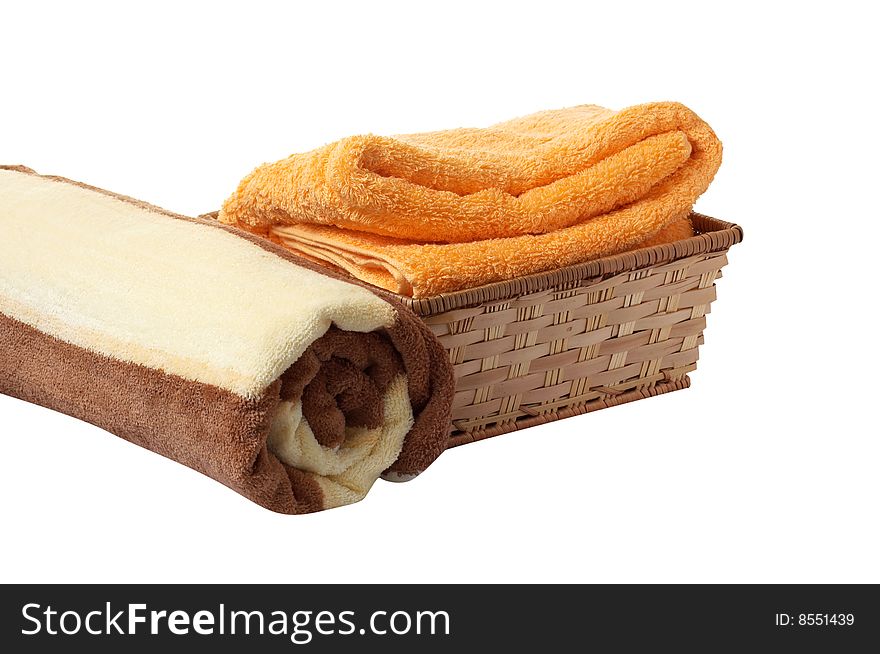 Towels and wonderful basket isolated on a white background. Towels and wonderful basket isolated on a white background.