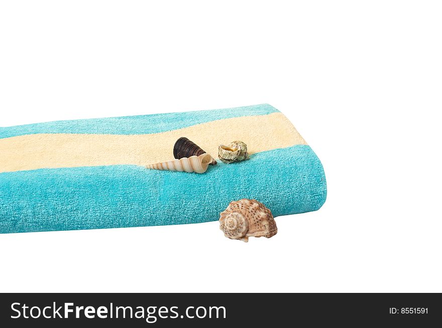 Turquoise towel and seashells  isolated on a white background. Turquoise towel and seashells  isolated on a white background.