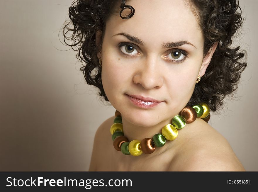 The beautiful girl on a grey background. The beautiful girl on a grey background