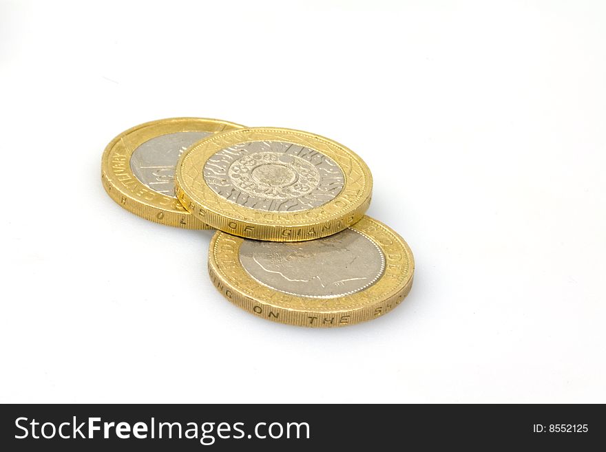 British two pound coins isolated on white. British two pound coins isolated on white