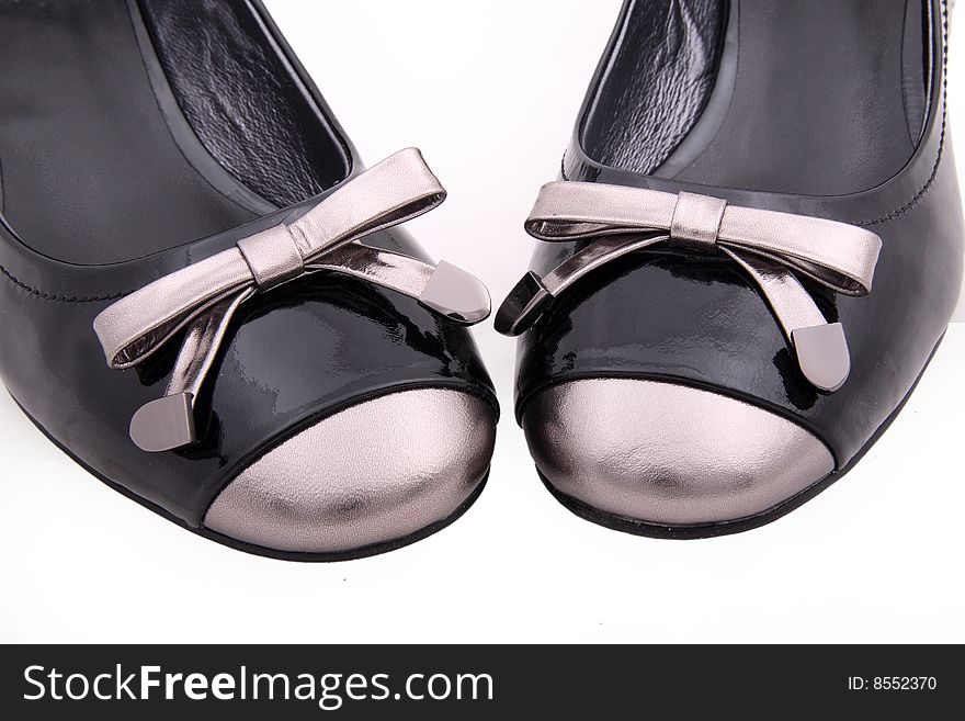 Black female shoes detail isolated on white background.