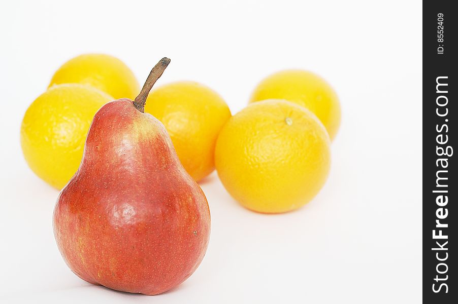 Oranges Behind A Red Pear