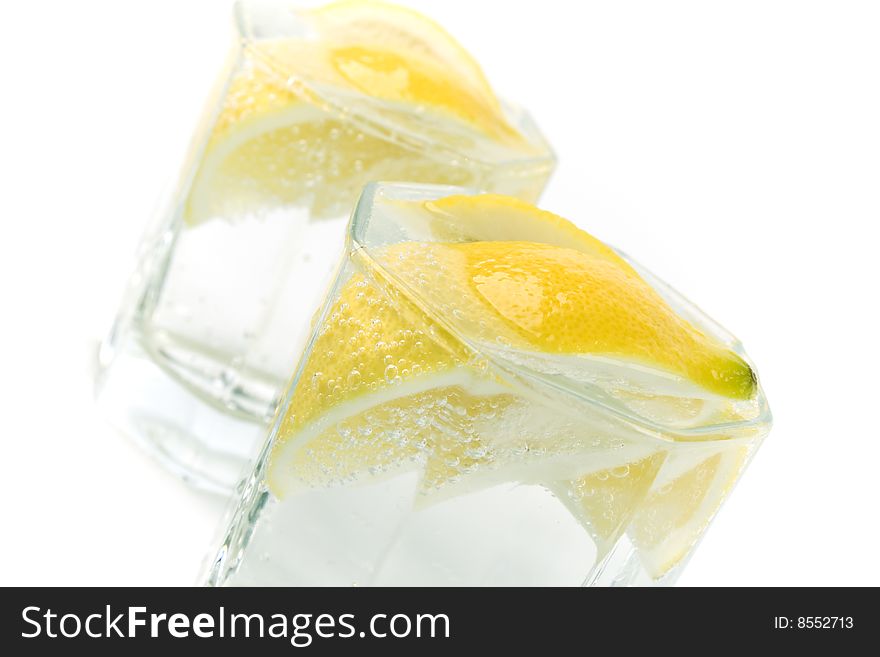 Two glasses with soda water and lemon slices