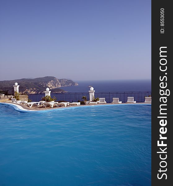 Swimming pool with ocean and mountain view