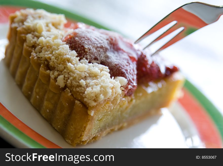 A delicious cheesecake desert being served. A delicious cheesecake desert being served.