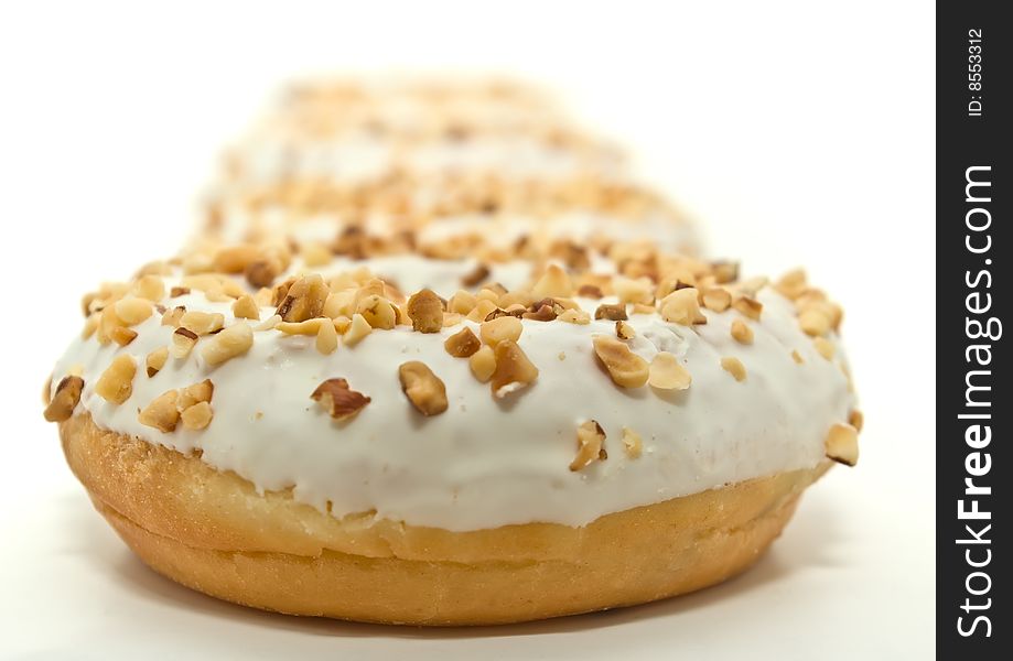 Donuts with sugar glaze and nuts