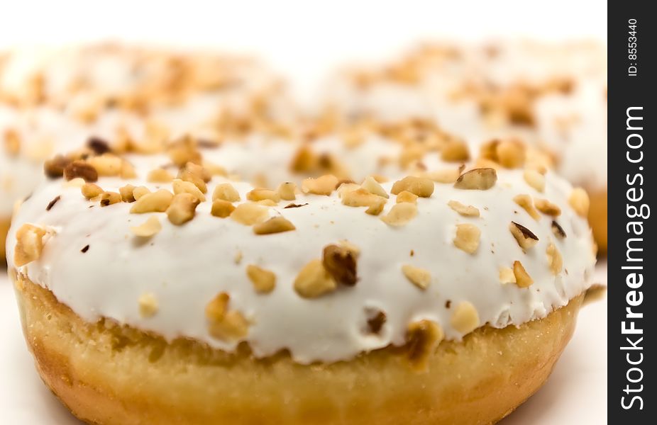 Donuts with sugar glaze and nuts