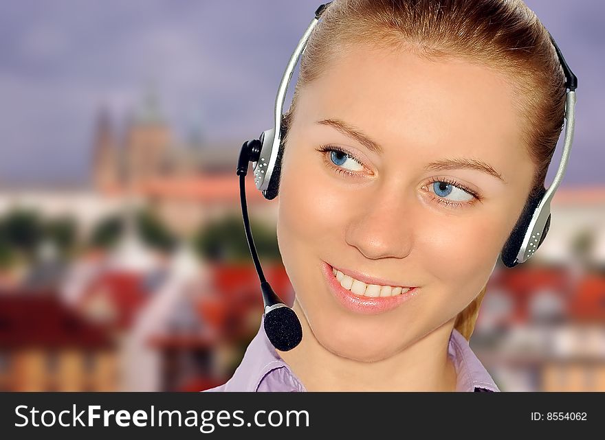 Woman wearing headset in office; could be receptionist