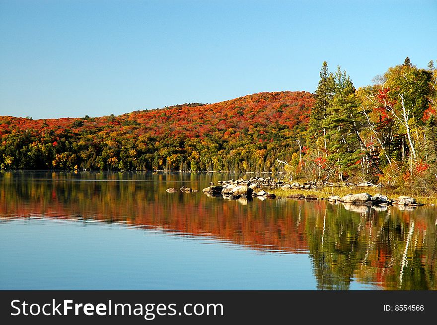 Autumn reflection on Flack Lake, Ontario