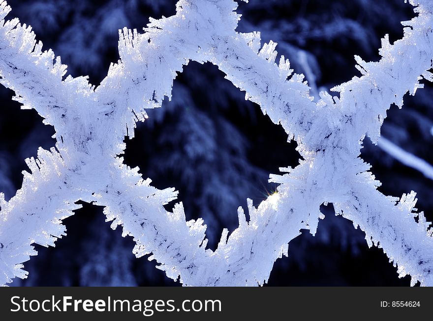 Fine ice crystals on chain link formed by hoar frost - close up. Fine ice crystals on chain link formed by hoar frost - close up