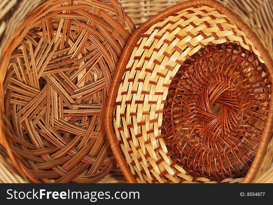 Horizontal close-up image of two baskets within a larger basket. Horizontal close-up image of two baskets within a larger basket.