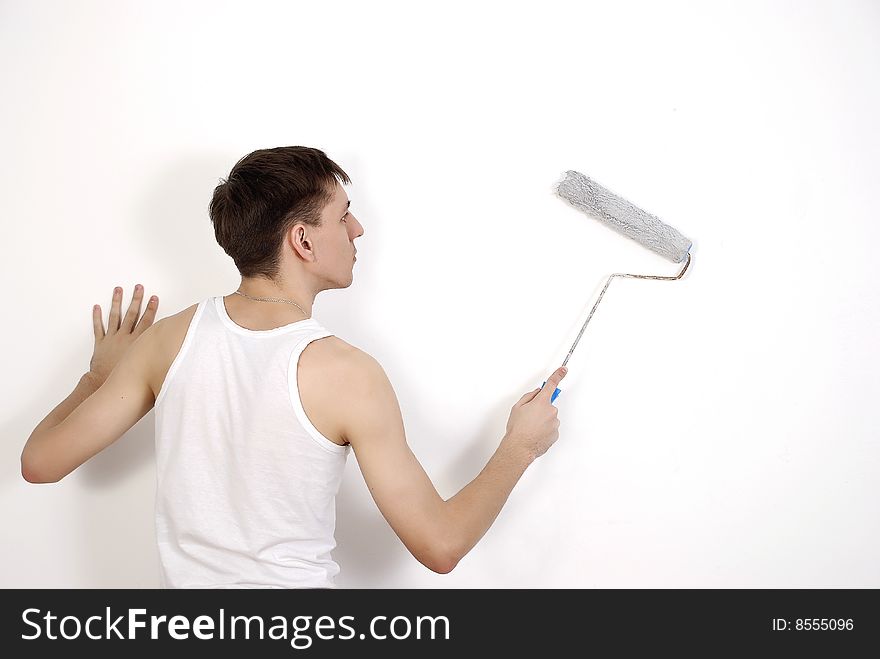 Man Painting A Wall