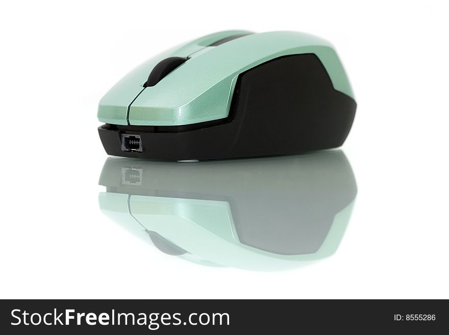 A wireless mouse isolated on white background with mirror reflection.