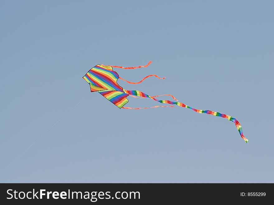 Flying kite isolated on blue sky