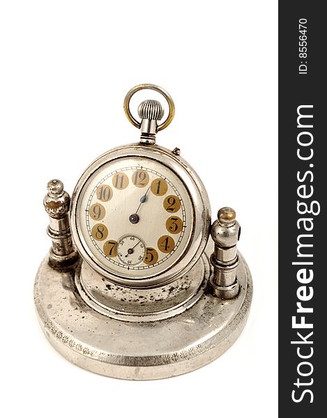 An old fashioned clock on white background. An old fashioned clock on white background