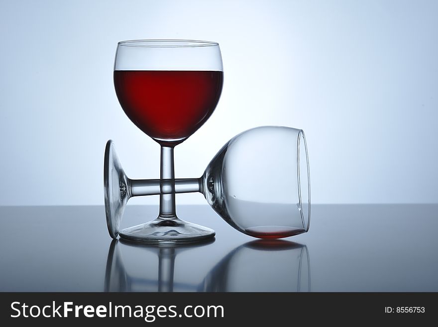 Two glass with red wine on a table, close up. Two glass with red wine on a table, close up