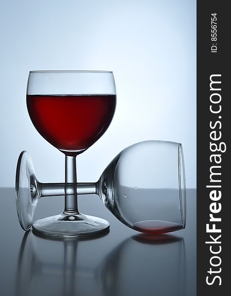 Two glass with red wine on a table, close up. Two glass with red wine on a table, close up