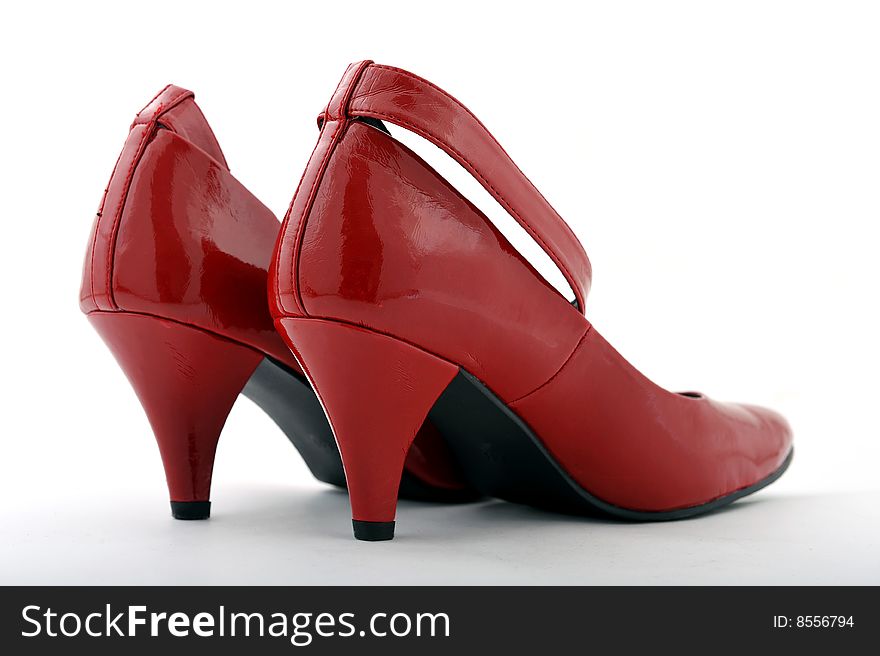 Women red high heel shoes on white background