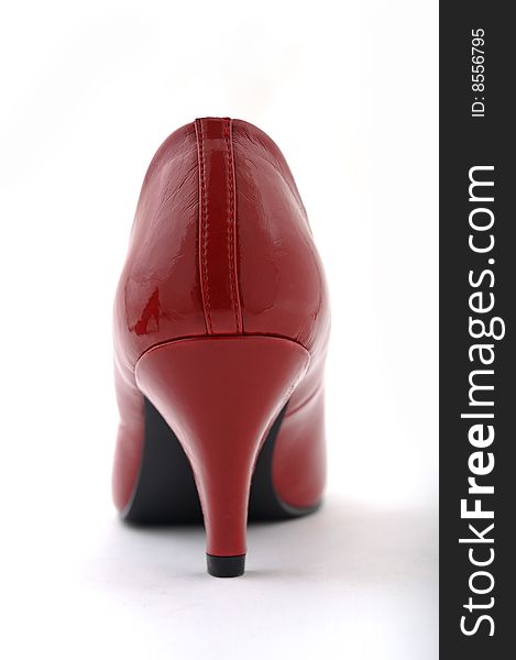 Women red high heel shoe on white background