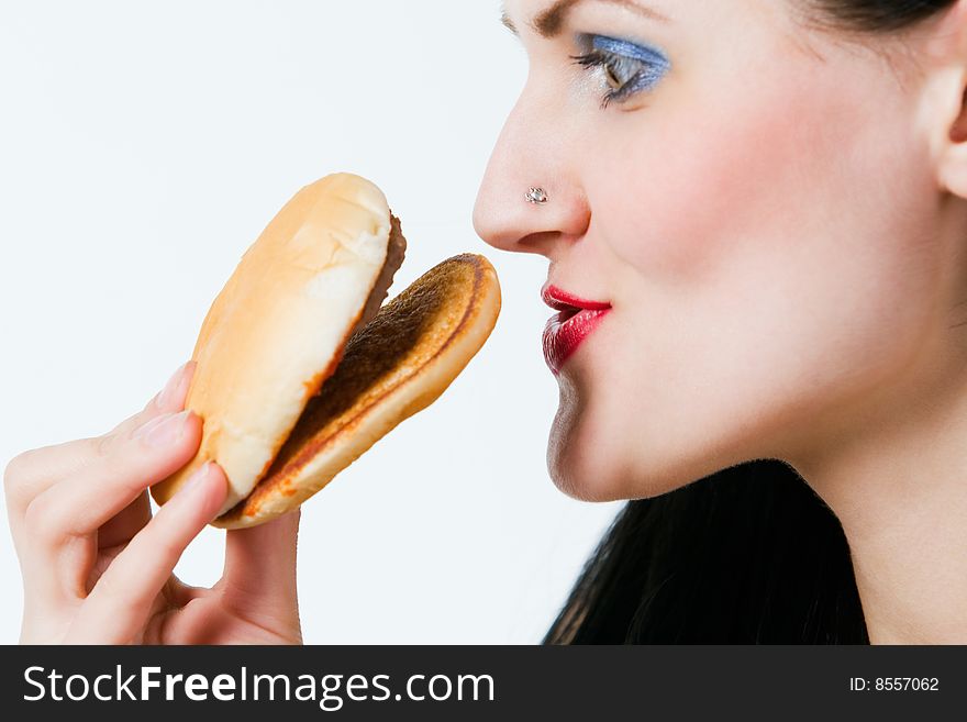 Attractive young lady eating burger. Attractive young lady eating burger