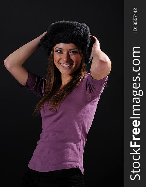 Woman in a fancy russian hat over black