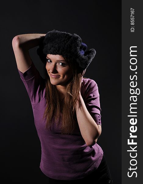 Woman in a fancy russian hat over black