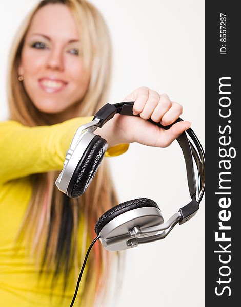 Attractive young girl with headphones over white background. Attractive young girl with headphones over white background