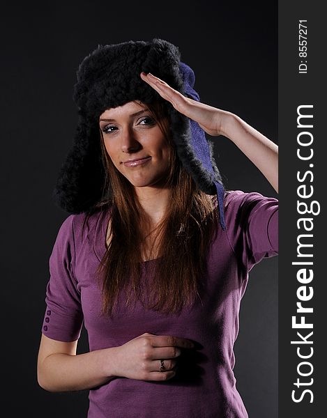 Woman in a fancy russian hat over black