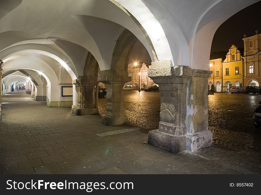 Arcade with town square in Litomysl at night lighting. UNESCO heritage.