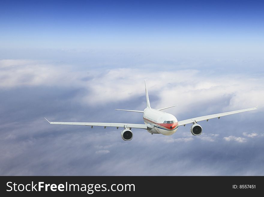 The airplane on  the blue sky background. The airplane on  the blue sky background.