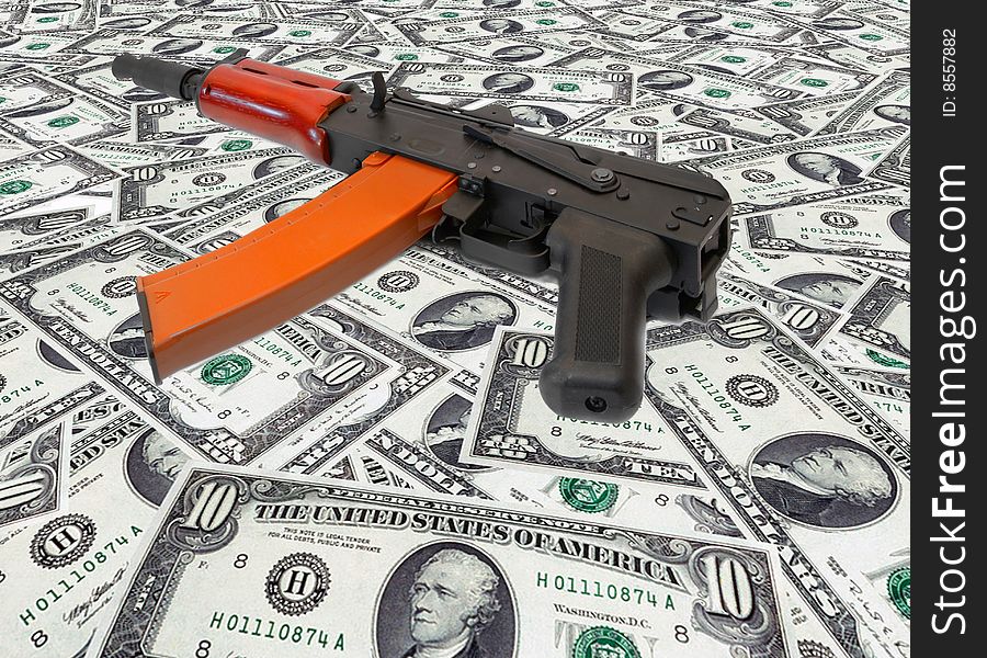 The weapon lies on US dollars