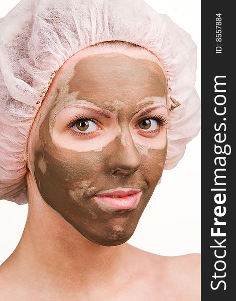 Young healthy woman with facial mask