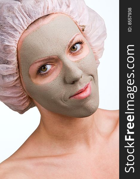 Young healthy woman with facial mask