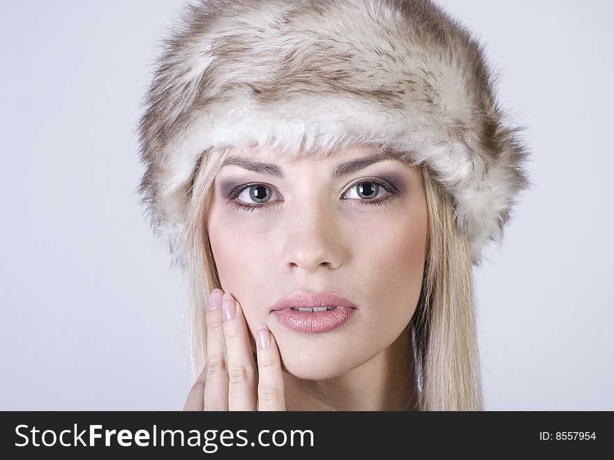 Beautiful winter girl in a warm hat