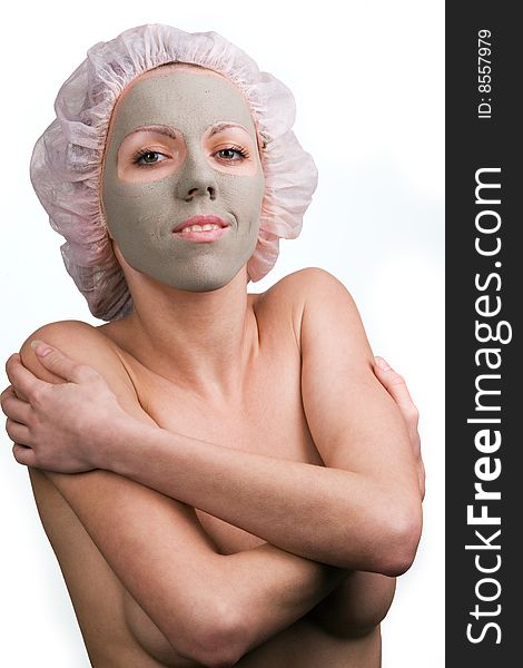 Young healthy woman with facial mask