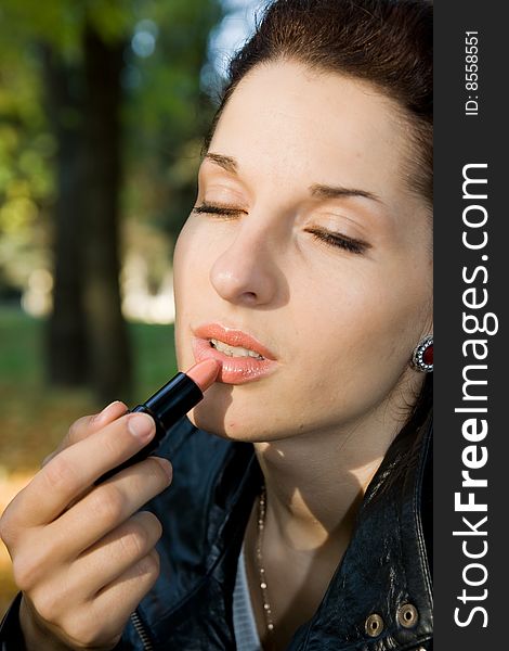 Portrait of pretty girl with lipstick