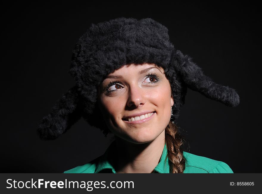 Woman in a fancy russian hat over black