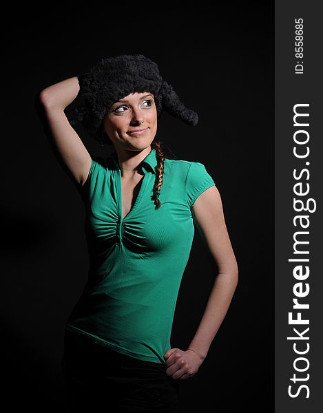 Woman in a fancy russian hat over black