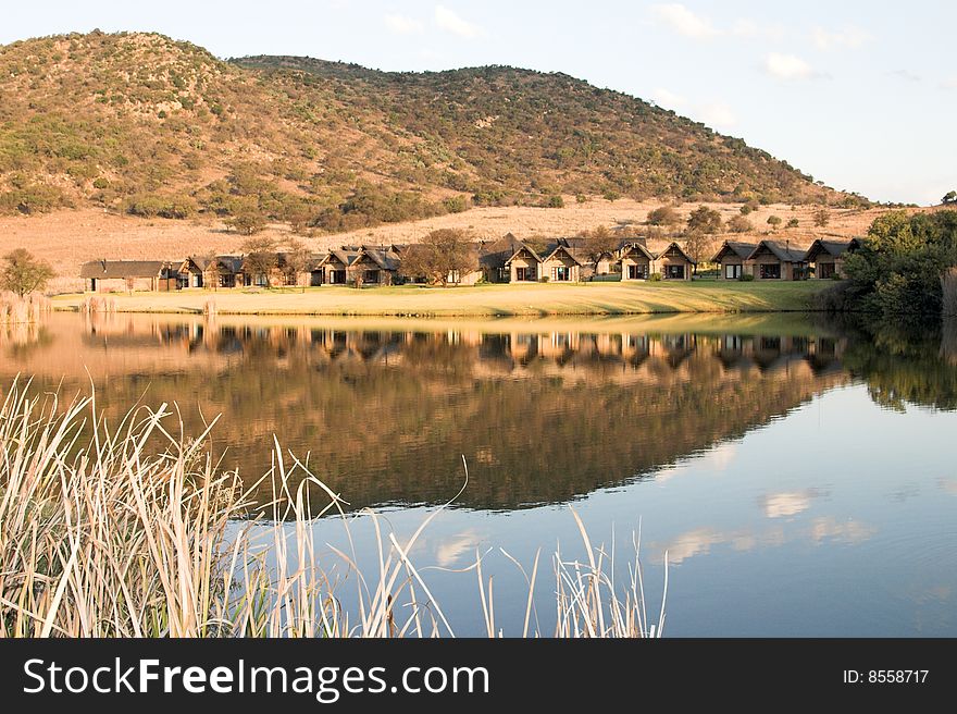 Reflection of sky and mountain on a still dam. Reflection of sky and mountain on a still dam