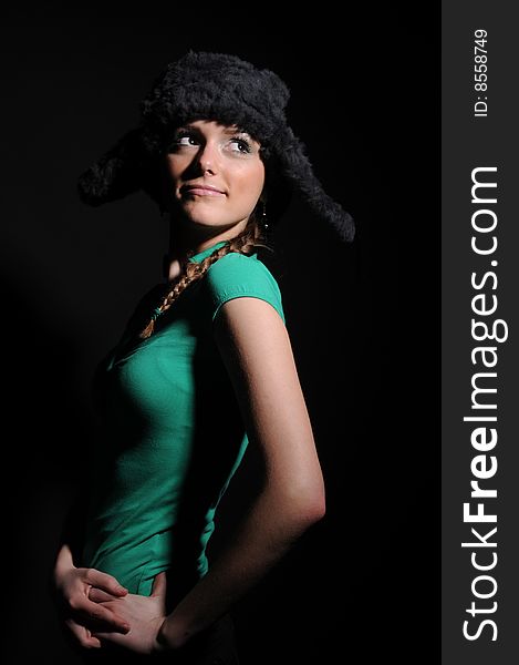 Woman in a fancy russian hat over black