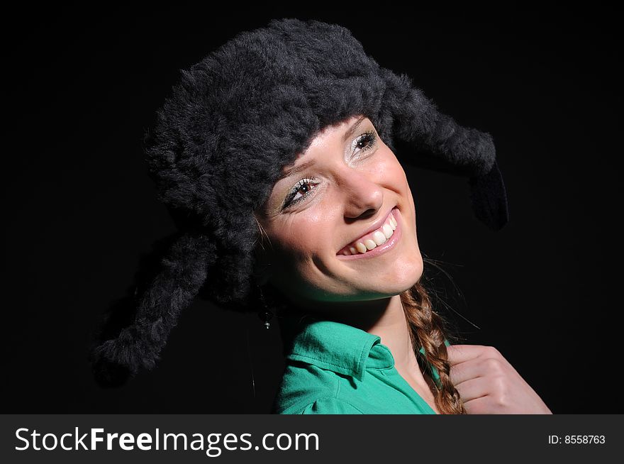 Woman in a fancy russian hat over black