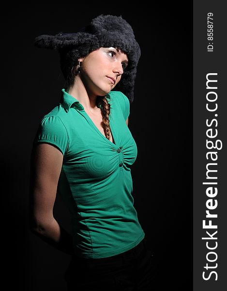 Woman in a fancy russian hat over black