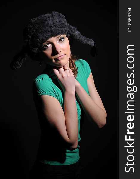 Woman in a fancy russian hat over black