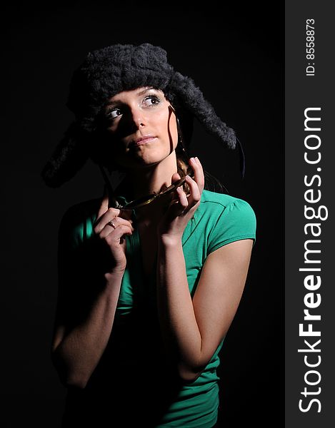 Woman in a fancy russian hat over black