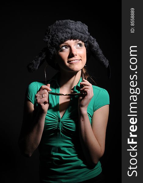 Woman in a fancy russian hat over black