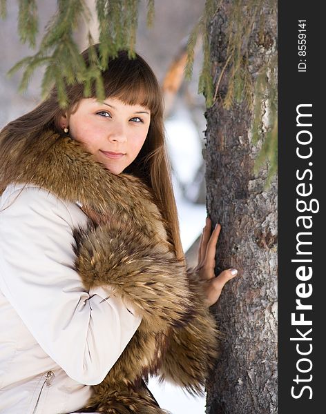 Portrait of dreaming young woman in fur edged jacket. Portrait of dreaming young woman in fur edged jacket